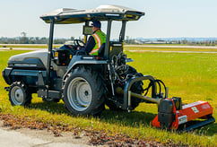 Monarch Tractor mowing at an airport