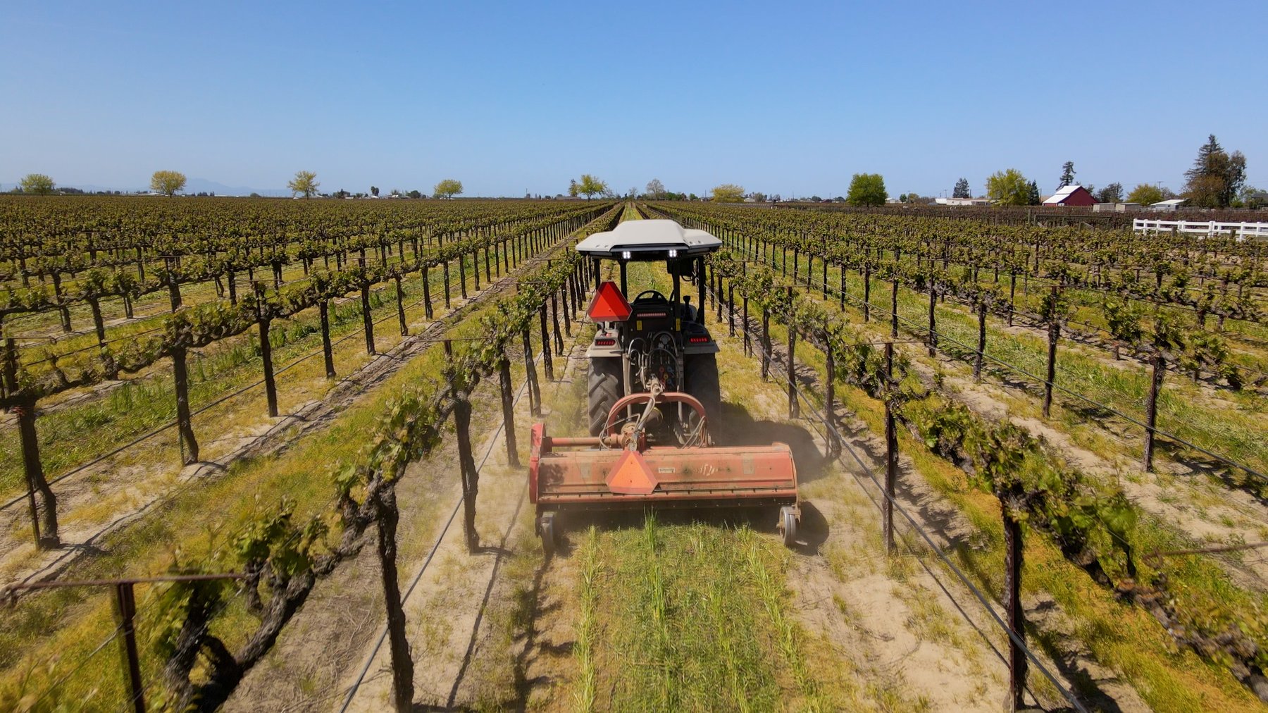 MK-V Autonomous electric tractor in driving through vineyard