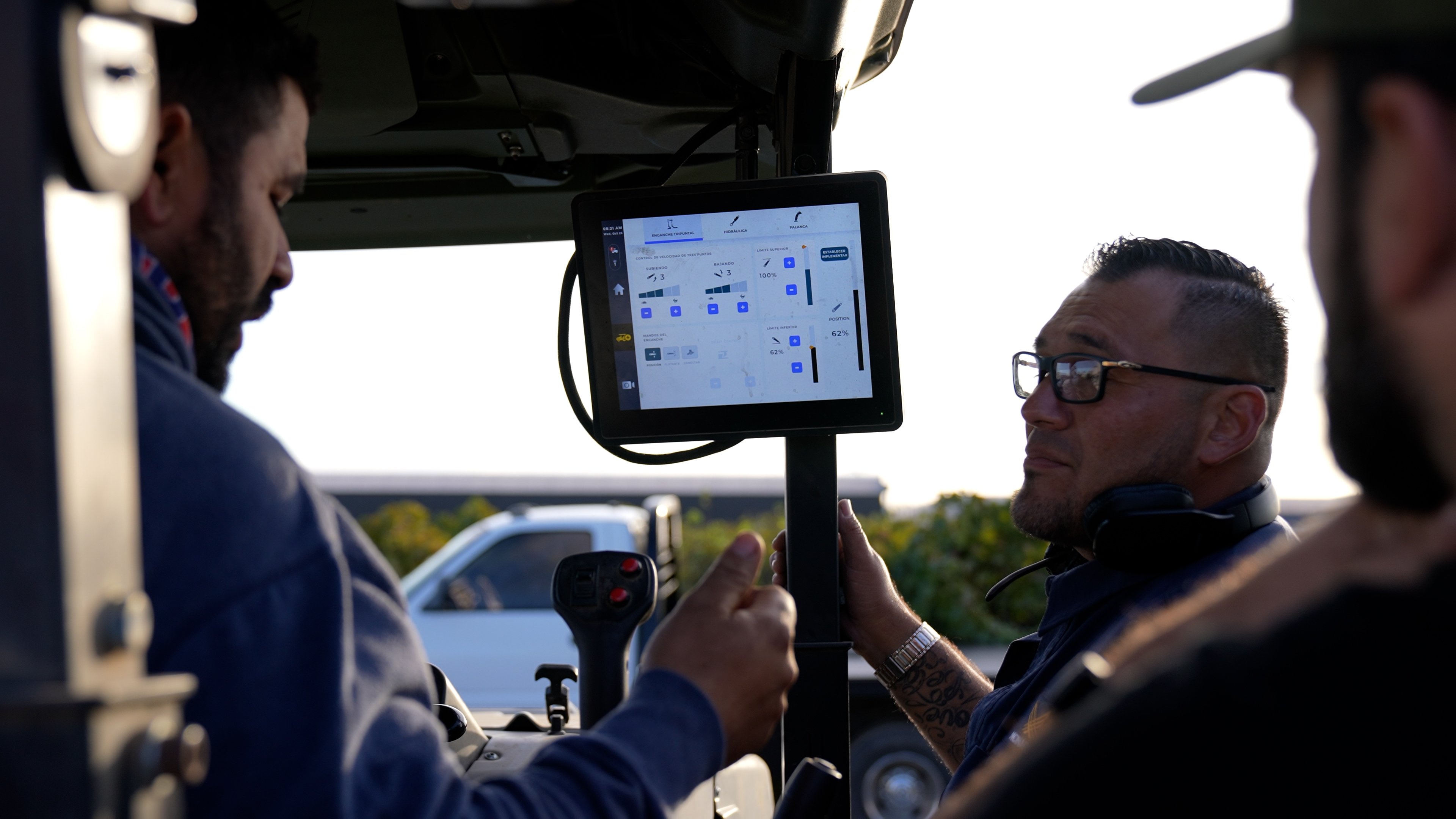 Farmers using MK-V tractor digital technology 